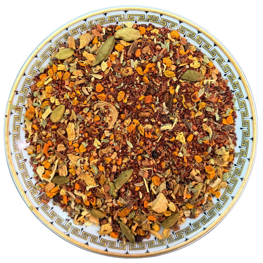 Spice mix on a decorative plate with a white background