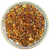 Spice mix on a decorative plate with a white background