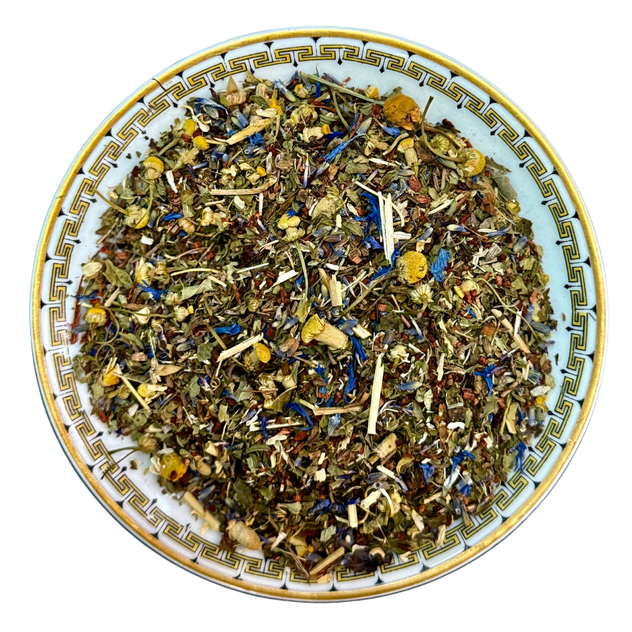 Herbal tea mix on a decorative plate with a white background